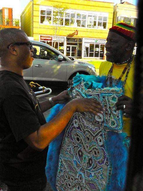 Reginald & Big Chief Fi Yi Yi holding costume