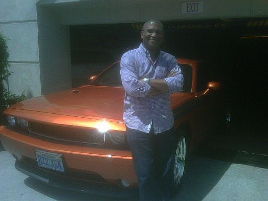 Reggie with red Dodge Challenger